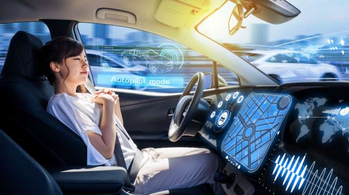 Woman in futuristic self driving car