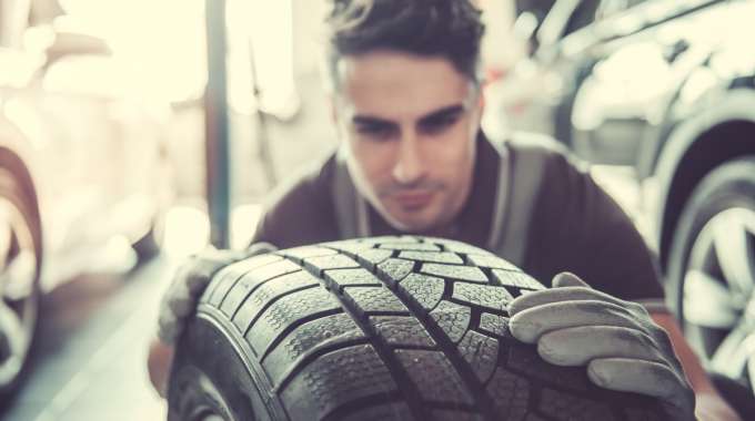 Mechanic Inspects Tire